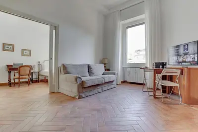 a living room with a couch and a table at Home and More St. Angelo APT 5 in Rome