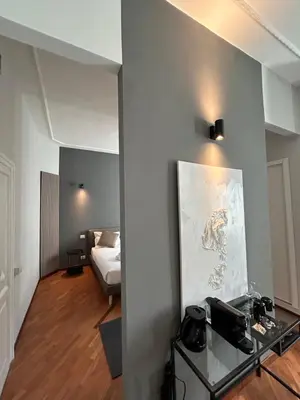 a room with a bed and a glass table at Sopi Vatican Suite Apartment in Rome