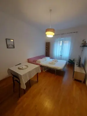 a living room with a couch and a table at VATICAN PITTORE HOUSE in Rome