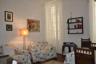 a living room with two chairs and a lamp at ROME FOR TWO Campo de' Fiori - your home in Rome in Rome