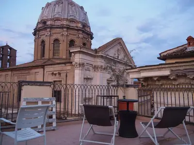 two chairs sitting in front of a building at ROME FOR TWO Campo de' Fiori - your home in Rome in Rome