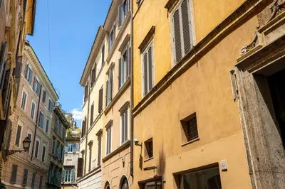 an old building with windows on a city street at Home at Rome Luxury Navona Guest House 2 in Rome