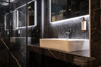 a bathroom with a white sink and a mirror at Home at Rome Luxury Navona Guest House 2 in Rome