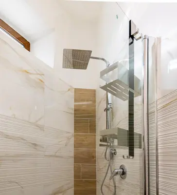 a bathroom with a shower with a glass door at VivimiHome - Holiday Life Rome in Rome