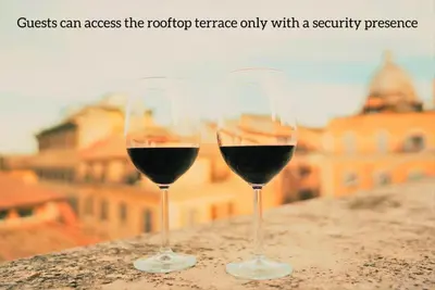 two glasses of red wine sitting on a ledge at The Best Nest - Home Suite Home NEW OPENING in Rome