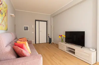 a living room with a couch and a flat screen tv at Marisa Home in Rome