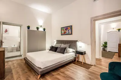 a bedroom with a bed in a room at MONTI QUIET AND SPACIOUS APARTMENT in Rome