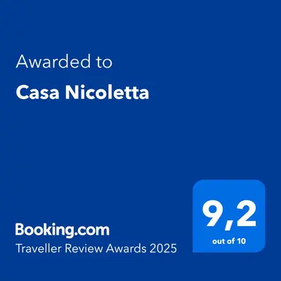 a blue text box with the words awarded to csa nica nicaica at Casa Nicoletta in Rome