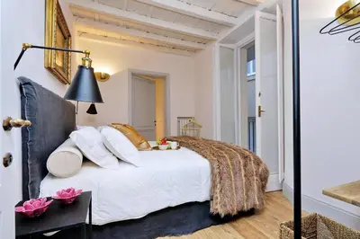 a bedroom with a large white bed with white pillows at Luxury Charme between Pantheon and Spanish Steps in Rome