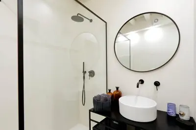 a bathroom with a sink and a mirror at Luxury Charme between Pantheon and Spanish Steps in Rome
