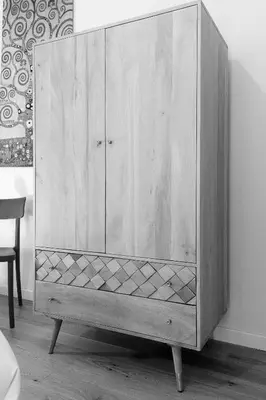 a wooden cabinet is sitting in a room at Trastevere Andrea' s home in Rome