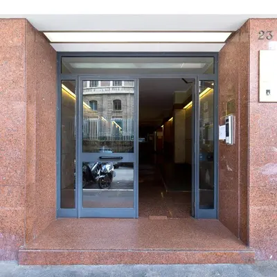 an open door with a motorcycle inside of a building at Trastevere Andrea' s home in Rome