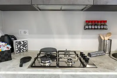 a stove top oven sitting on top of a kitchen counter at A casa di Elly 2 in Rome