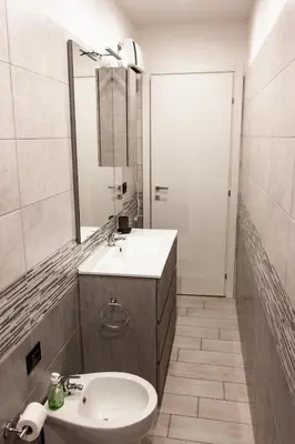 a bathroom with a sink and a mirror at Domus Marconi Roma in Rome