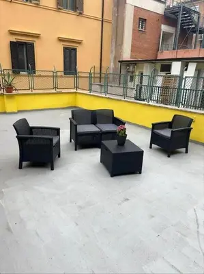a group of chairs and tables on a patio at Domus Pretorio in Rome