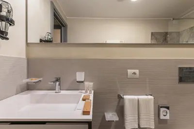 a bathroom with a white sink and a mirror at MyItalyHome Roma in Rome