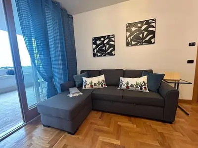 a living room with a couch and a table at Miro Home in Rome