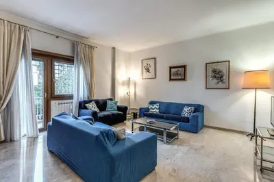 a living room with two blue couches and a table at Bellavista - Family&Friends big House-Saint Peter in Rome