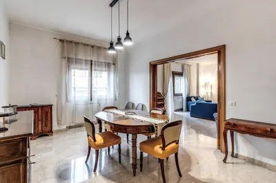 a dining room with a table and chairs and a mirror at Bellavista - Family&Friends big House-Saint Peter in Rome