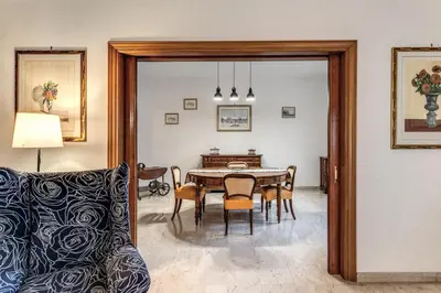 a dining room with a table and chairs and a couch at Bellavista - Family&Friends big House-Saint Peter in Rome