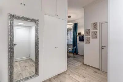 a mirror on a wall in a living room at Flaminio Royal Apartment in Rome