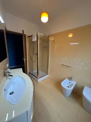 a bathroom with a sink and a shower and a toilet at The Vatican Jungle loft con giardino vicino al Vaticano in Rome