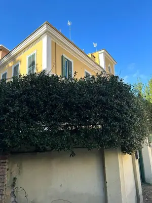 a building with a large bush on the side of it at The Vatican Jungle loft con giardino vicino al Vaticano in Rome