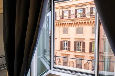 a window with a view of a building at DOMUS TRAIANA in Rome