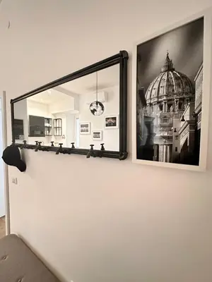 a mirror on a wall with a picture of a building at St. Peter's Balloon a due passi da San Pietro! in Rome