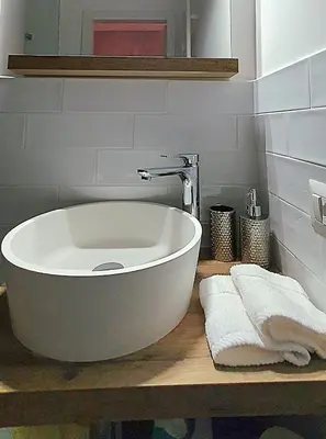 a large white bath tub sitting on a counter in a bathroom at St. Peter's Balloon a due passi da San Pietro! in Rome
