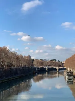 a view of a river with a bridge at Casa Vicolo Moroni - Trastevere in Rome