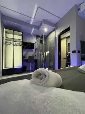 a bedroom with a bed with a towel on it at HeySuite - Luxury House - ROMA Trastevere in Rome