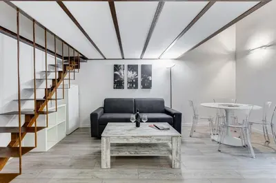 a living room with a couch and a table at Inner House 3 in Rome