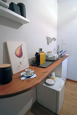 a kitchen with a counter top with a coffee maker at Gelso in Rome