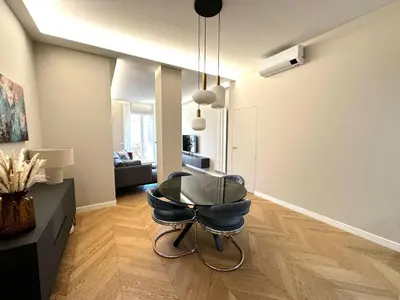 a chair in a room with a living room at Giulia’s Corner in Rome