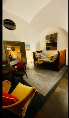 a living room with a couch and a table at Apartamento loft ingresso independente central zona san lorenzo in Rome