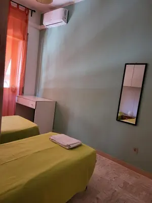 a kitchen with a table and a dining room at Home Sweet Home Tiburtina Station in Rome