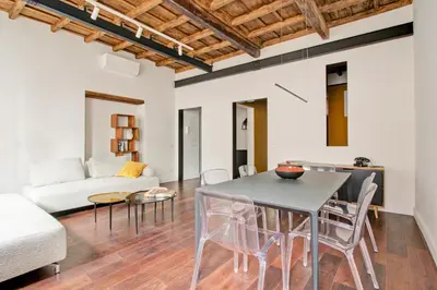 a living room with a table and chairs and a couch at CoroCoro114 Comfort ed Eleganza in Rome