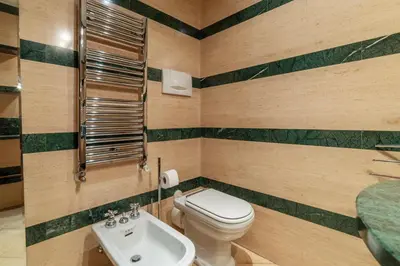 a bathroom with a toilet and a sink at GuestHost - Campo de Fiori Unique Apartment in Rome