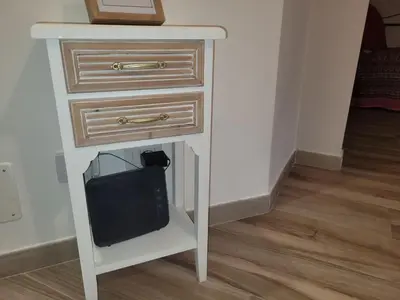 a white table with a drawer and a tv on it at in the garden in Rome