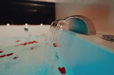 a stream of water coming out of a faucet at Mirror Suite Roma Colosseo Monti con Jacuzzi in Rome