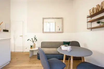 a living room with a couch and a table at Cinque Loft in Rome