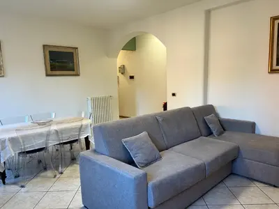 a living room with a couch and a table at Casa dei fiori by GHOR in Rome