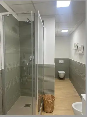 a glass shower in a bathroom with a toilet at Cola di Rienzo 243 Relais-A in Rome