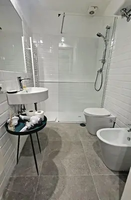 a bathroom with a sink and a tub and a toilet at Appartamento Piazza Navona in Rome