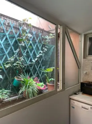 a window with potted plants in a room at Centro storico appartamento con terrazza in Rome