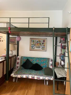 a living room with a bunk bed and a couch at Centro storico appartamento con terrazza in Rome