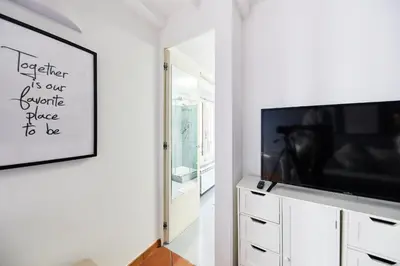 a living room with a flat screen tv and a mirror at iFlat Wonderful Home in Monti in Rome