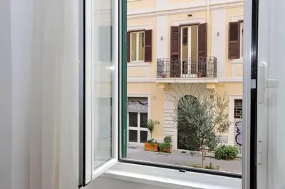 an open window with a view of a building at Super appartamento nel cuore del Pigneto in Rome