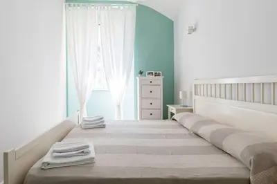 a bedroom with a large bed with towels on it at Casa Esquilina in Rome